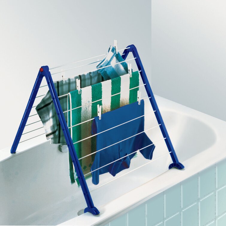 Drying rack over outlet bathtub